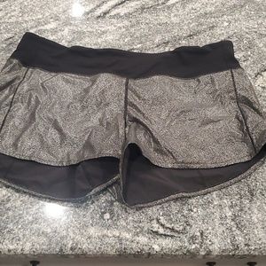 Woman's black/silver short athletic shorts.